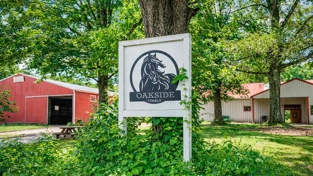Oakside Stable equestrian facility with barns and riding arenas