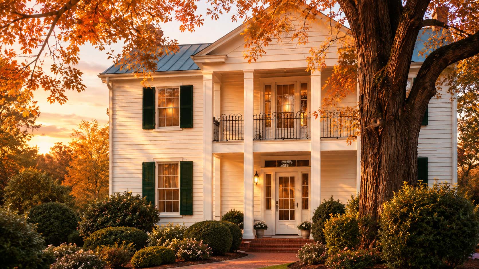 Historic Central Virginia country home with a columned entrance in morning light
