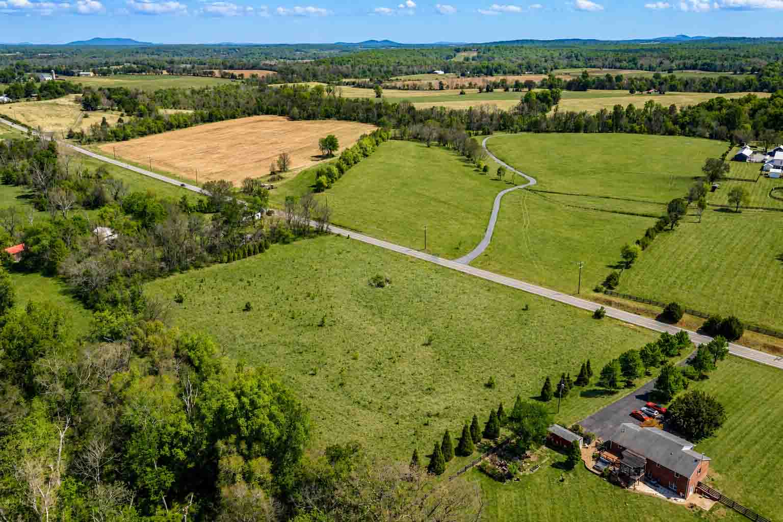 Land for sale near Somerset, Virginia, with open homesites and distant Blue Ridge Mountain views